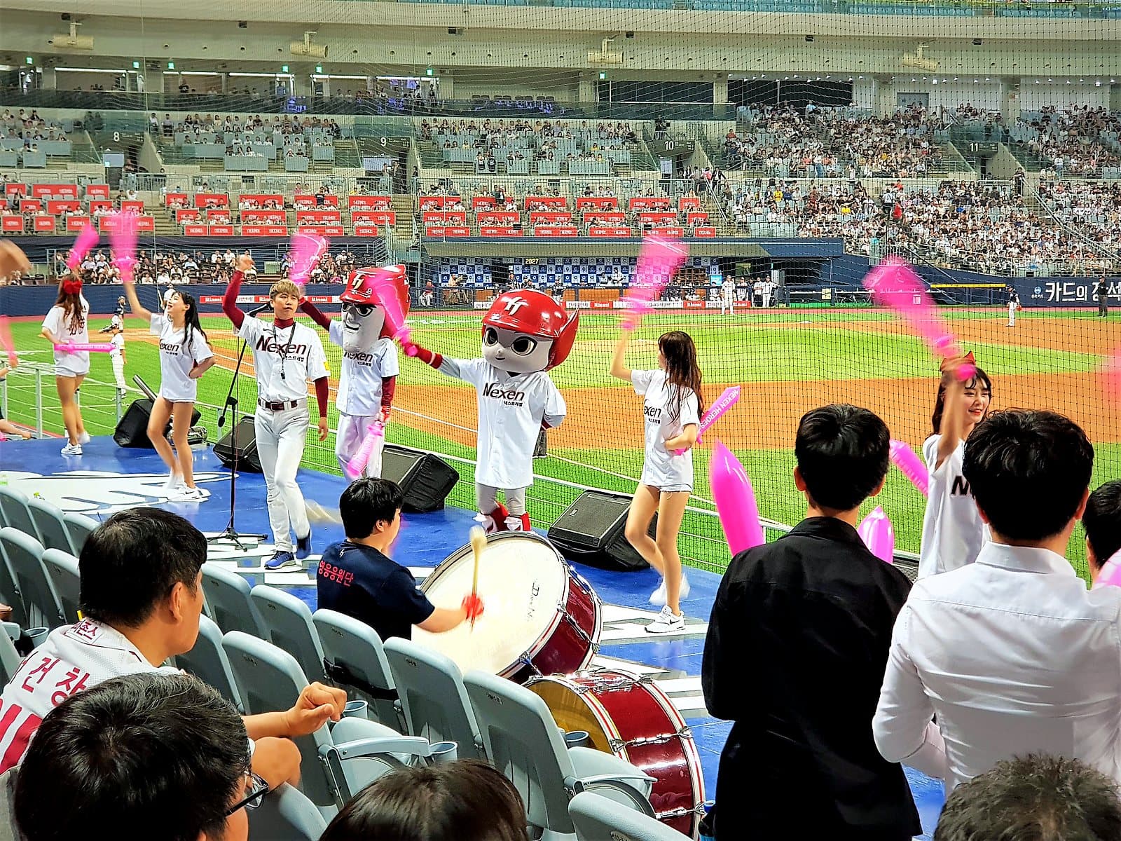 Fans in the cheering section at Gocheok Sky Dome, Seoul's indoor baseball stadium