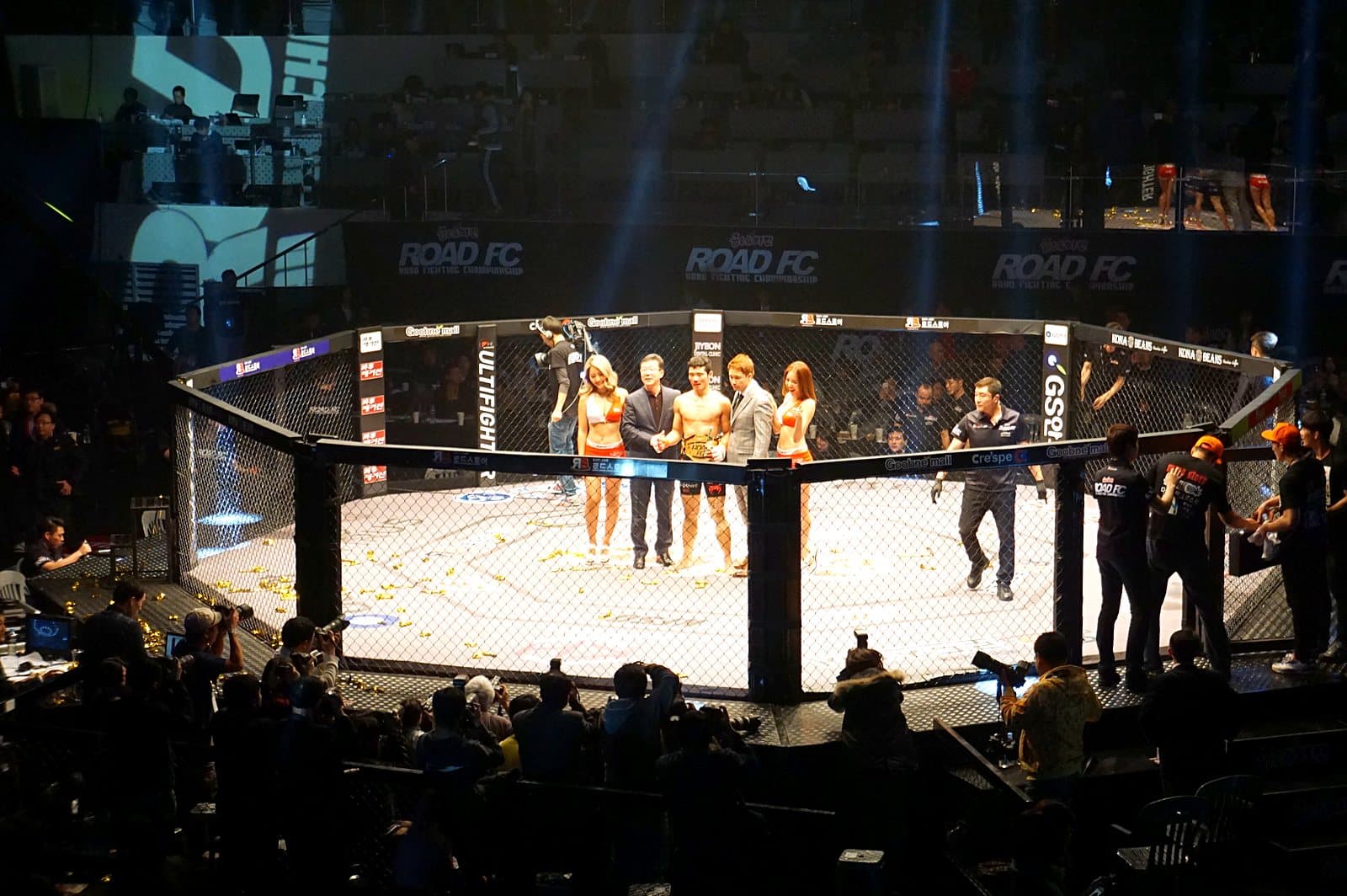 A Road FC featherweight championship bout in the cage at a Korean MMA event